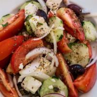 Greek Salad (Horiatiki) · Greek peasant salad. Cucumber, tomatoes, feta, olives, capers, onions, oregano and olive oil.