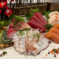 Sashimi Deluxe · 18pcs assorted of raw fish & sushi rice.