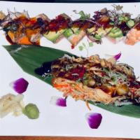 Volcano Roll · Eel, avocado inside, topped with spicy crab, scallop, white fish, scallion, fish egg & eel s...