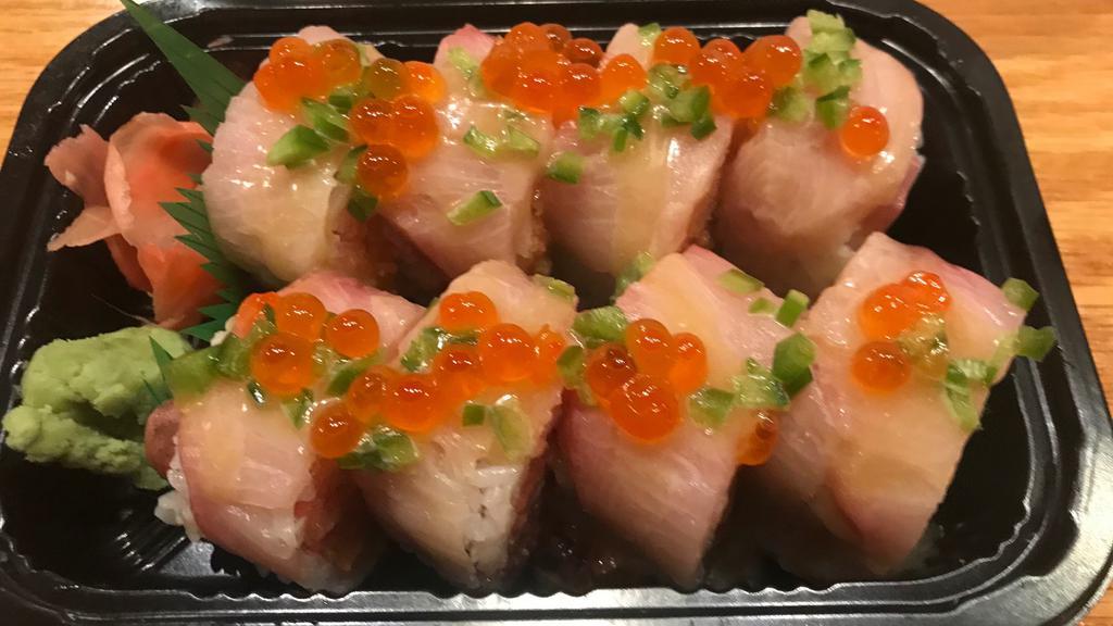 Pearl Roll · Spicy tuna, spicy salmon, avocado, cucumber wrapped with soybean paper topped with yellowtail, jalapeño, salmon roe & honey wasabi sauce.