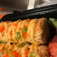 Torched Roll · Crabmeat cucumber, avocado, crunch inside, torched salmon, fish egg & spicy mayo sauce.