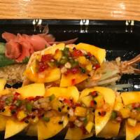 Golden Island Roll · Shrimp tempura, cucumber wrapped with soybean paper, topped with spicy crab & mango, with sa...