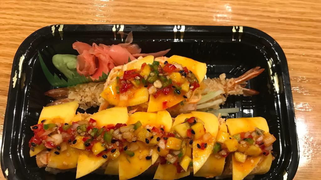 Golden Island Roll · Shrimp tempura, cucumber wrapped with soybean paper, topped with spicy crab & mango, with salsa sauce.