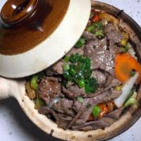 Cơm Tay Cầm Heo/Bò/Gà Nướng · Rice clay pot with choice of grilled pork, beef or chicken.