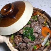 Com Tay Cam Heo/Bò/Gà Xào · Rice clay pot with a choice of pork, beef or chicken stir fry