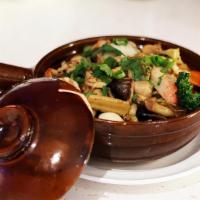 Com Tay Cam Hai San · Rice clay pot with seafood and vegetable.