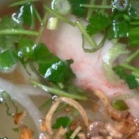 Hủ Tiếu Nam Vang · Chicken noodle soup with Clear noodle top with sliced pork, shrimp, squid, imitation crabmea...