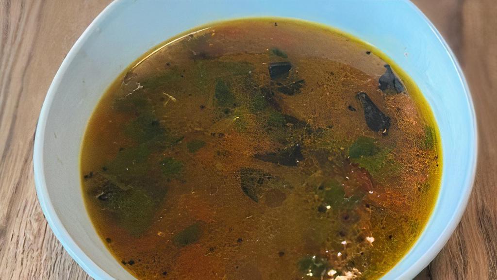 Mulligatawny Soup · A broth made from lentils and boiled rice. Soup is prepared from a base of tamarind, tomato, cumin, peppercorns, turmeric, and curry leaves. Lightly spiced soup.