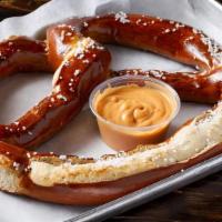 Giant Pretzel · Extra large 10 oz Bavarian pretzel with a side of cheese.