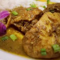 Curry Chicken · Chicken cooked in delicious Trinidadian curry sauce and served with basmati rice.