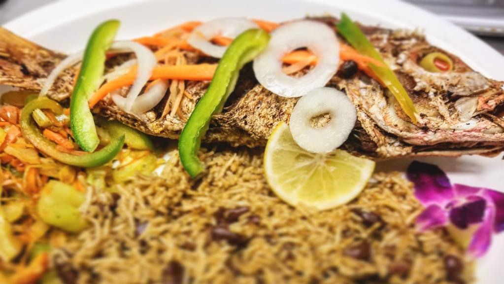 Escoveitched Fish · Red snapper seasoned and deep fried  served with basmati rice.