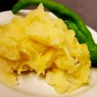 Boil And Fried Cassava (Yucca) · Cassava (yucca)  steamed and fried in a buttery sauce, fresh blend of herb, a hearty side di...