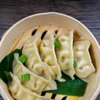Gyoza · Steamed or Fried dumpling filled with ground chicken and vegetables served with gingered soy...