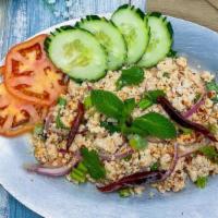 Larb Gai · Medium Spicy. Ground chicken mixed with red onions, scallions, fresh mint, roasted rice, cil...