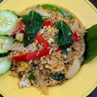 Basil Fried Rice · Medium Spicy. Fried rice with egg, onions, bell peppers, hot peppers, and basil leaves.