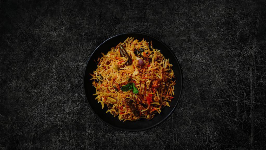 Veggie Delight Biryani (Vegan) · Our long grain basmati rice cooked with nuts, fresh vegetables and a choice of protein in our special biryani masala gravy