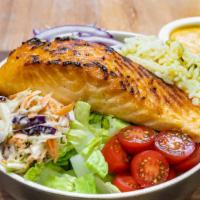 Salmon Bowl · An 8 Oz. Scottish salmon filet, greens, tomato, onion, coleslaw, rice, corn, dressing