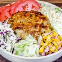 Crab Cake Bowl · Eight ounce jumbo lump crab cake, greens, tomato, coleslaw, rice, and dressing.