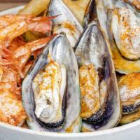 #63 Mussel & Shrimp Boil-Large · 14 Steamed mussels , 14 large shrimp, corn on the cob, broccoli, served in garlic butter sau...