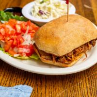 Pulled Pork Sandwich · Served with Coleslaw.