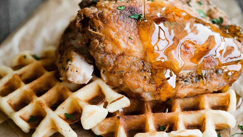 Chicken Wings & Premium Belgian Waffles · Premium Belgian waffles, made with authentic Belgian P4 pearl sugar, served with crispy chicken wings, maple syrup and butter.