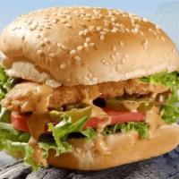 Spicy Crispy Chicken Sandwich · Fried crispy chicken filet on a butter toasted sesame roll with  fresh lettuce, tomato, Srir...