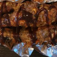 Ribs (Pork/Beef) · Savory ribs that fall right off the bones marinated in Liberian spices.