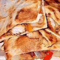 Quesadillas (Chicken, Steak,Or Shrimp) · Sautéed with spices and prepared with onions and sweet peppers.