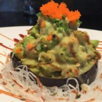 Avocado Blossom · In the half avocado shell, avocado baked with crab meat, surf clam and masago sauce.