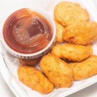 Chicken Nuggets · Served with honey mustard or BBQ sauce.