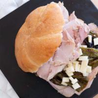 Lou'S Roast Pork Sandwich · Lou's Own Store-Made Roast Pork with Long Hot Peppers  and Sharp Provolone Cheese on a Kaise...