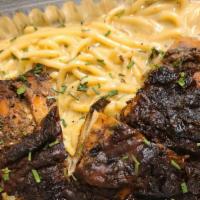 Jerk Chicken Alfredo Pasta · made with chicken over our famous jerk sauce