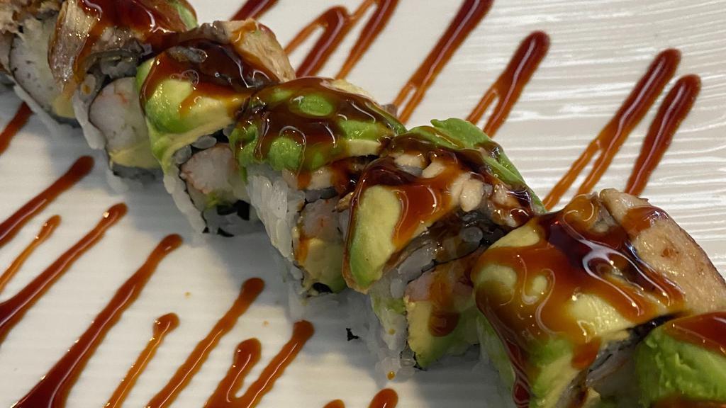  Dancing Dragon Roll · (In) crab meat, cucumber, and avocado; (top) eel and avocado with eel sauce.