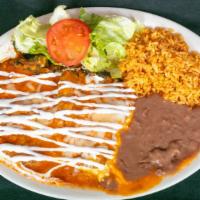 Chiles Rellenos · 2 chili peppers stuffed with cheese or picadillo (ground beef with potatoes) with melted che...