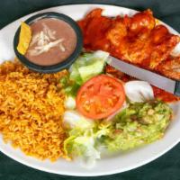 Pastor Plate · Pork cooked in chili salsa. Served with rice, beans, salad, tortillas and guacamole.