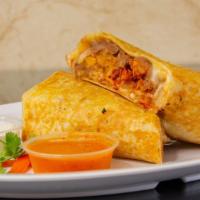 Burritos · A hand-wrapped burrito with rice, beans, pico de gallo. sour cream and cheese.
