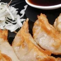 Gyoza · Fried veggie and chicken  dumplings served with a special soy sauce.