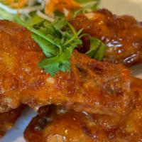 Bangkok Wings · Spicy. Fried chicken wings tossed with a house special sauce. (Mild spicy).