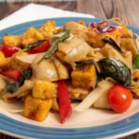 Drunken Noodle · Spicy. Stir-fried wide rice noodles with bell peppers, tomatoes, onions, and Thai basil in a...