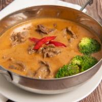 Panang Curry · Spicy. Panang curry paste with coconut milk, bell peppers, Thai basil and steam broccoli. (M...