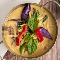Green Curry · Spicy. Green curry paste with coconut milk, eggplant, bamboo shoots, bell peppers, and Thai ...