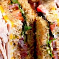 Turkey & Ham Club · Black forest ham and oven gold turkey breast, lettuce, tomatoes, American cheese and mayo on...