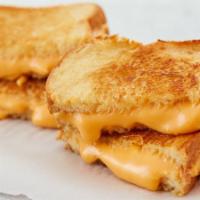 Grilled Cheese · Extra American Cheese on your choice of grilled bread.