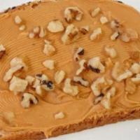 Peanut Butter Toast · Vegan. Peanut butter on thick multigrain bread and topped with walnuts.