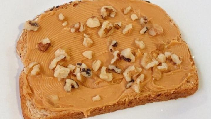 Peanut Butter Toast · Vegan. Peanut butter on thick multigrain bread and topped with walnuts.