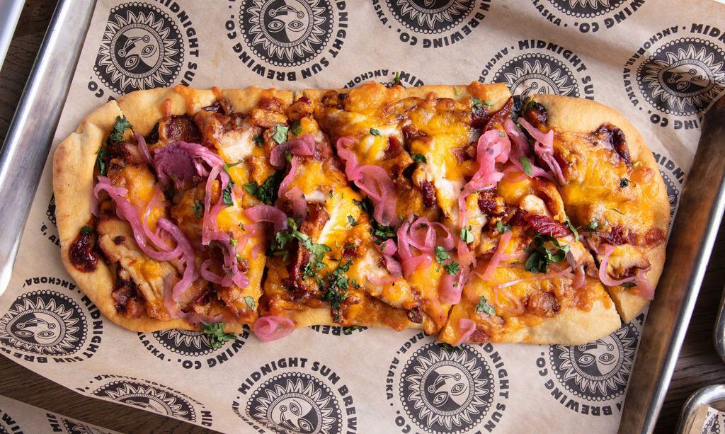 Beer-B-Q Flatbread · Panty Peeler BBQ sauce topped with
spicy marinated chicken, pecan wood-smoked
bacon, mozzarella cheddar blend, and finished with pickled red onions and fresh cilantro.