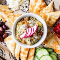 Green Chili Hummus · Vegetarian. Spicy and delicious hummus topped with spicy pepitas, cotija cheese & radish -  ...