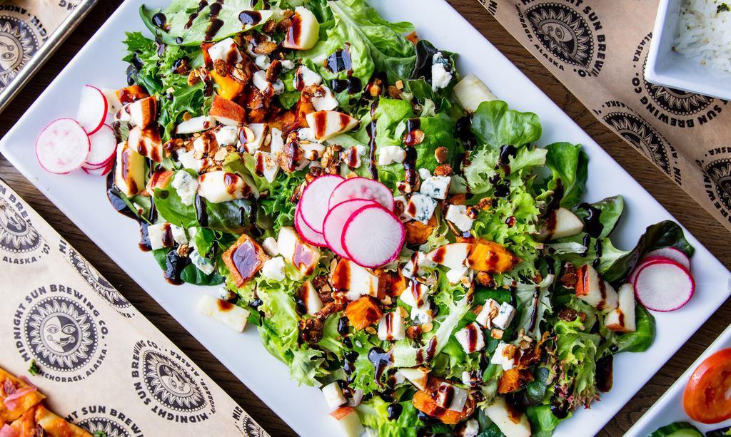 Harvester’S Delight · Brewhouse Fave & Gluten-Free. Local mixed greens and  kale tossed with diced apples, candied pepitas, roasted butternut squash, radish, bleu cheese crumbles, and maple-spiced vinaigrette with a balsamic drizzle.