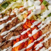 Combo (Chicken & Gyro) Over Rice · Mixed chicken and gyro  over rice with a Free drink of your choice