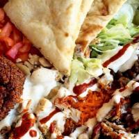 Big Combo Over Rice · Chicken, gyro and falafel combination of the three served with basmati rice and freshly cut ...